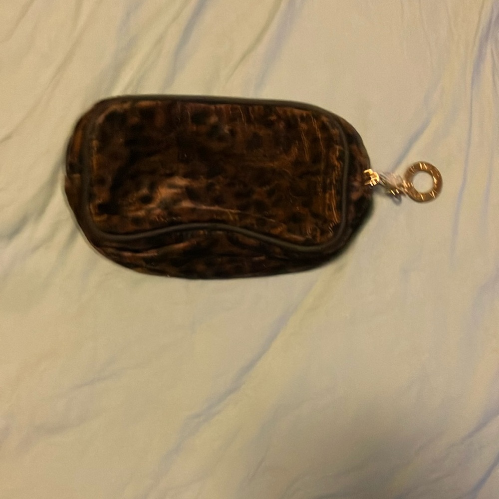 Adrienne Vittadini leopard print cosmetic bag.